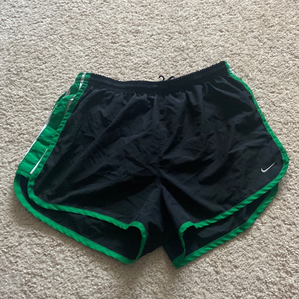 Black and green Nike running shorts